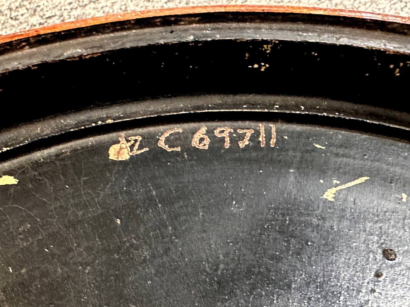 Inscription C69711 carved into the underside of the resonator back